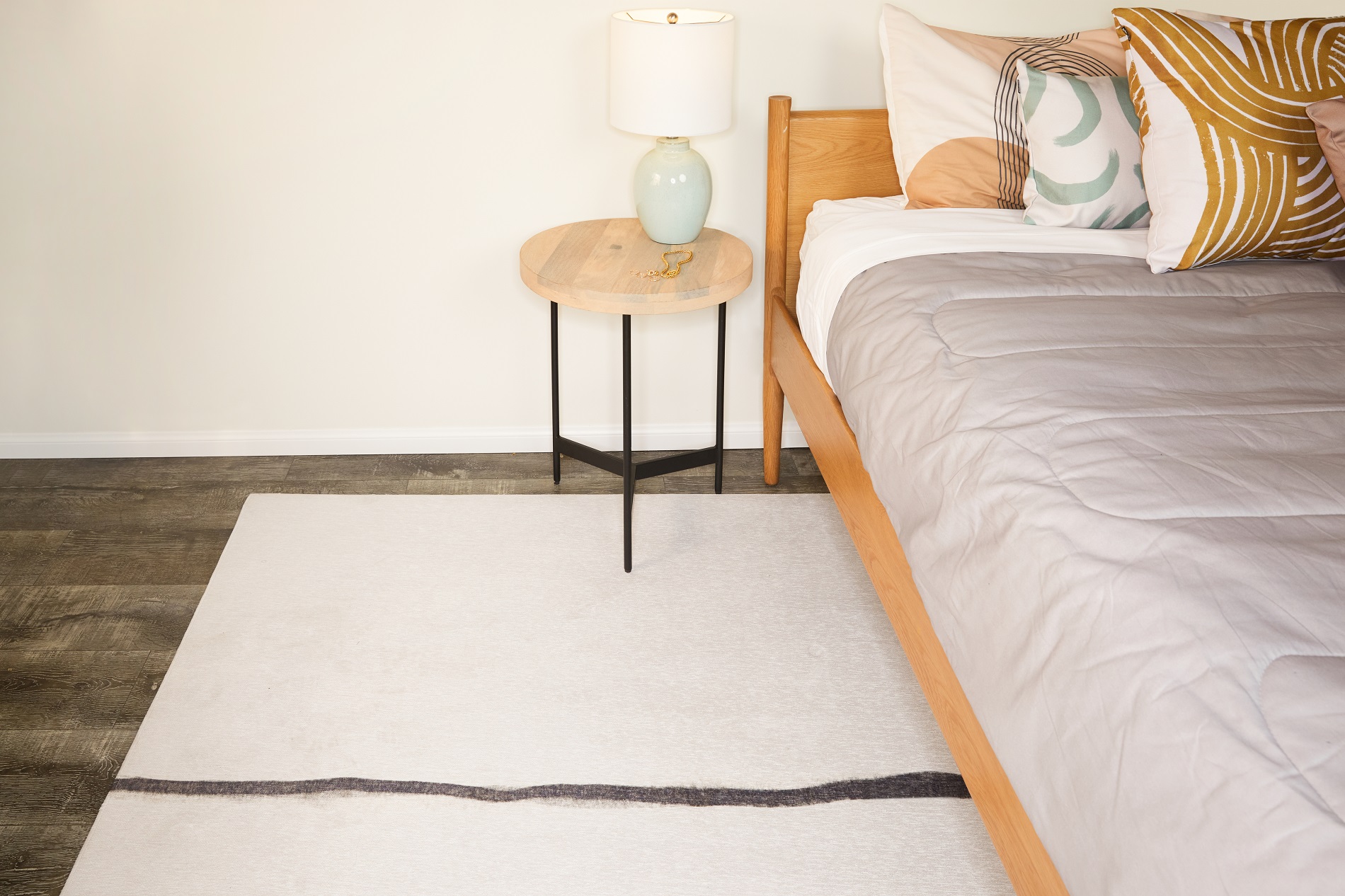 Area Rug Placement and Rug Sizes Under Queen Bed