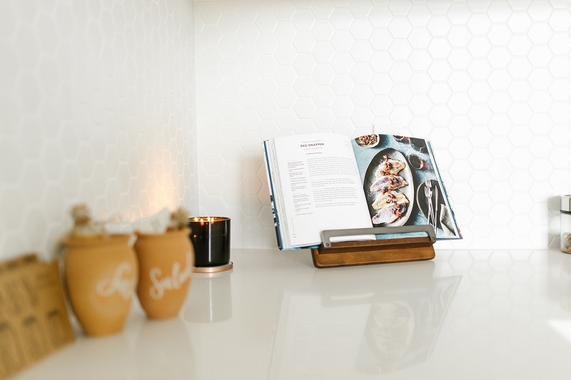 Open cookbook on the kitchen counter