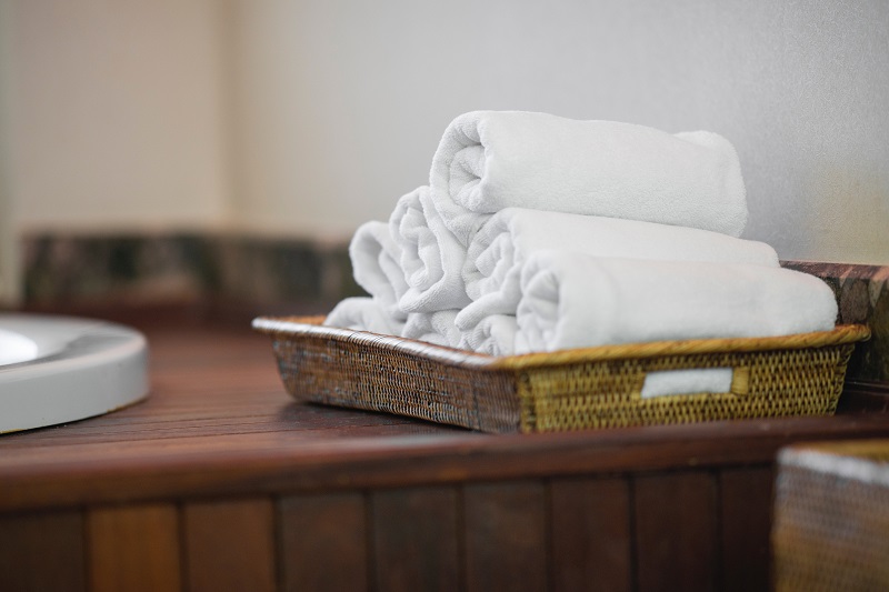 towels rolled on a tray