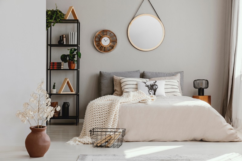 A statement mirror decorate over bed
